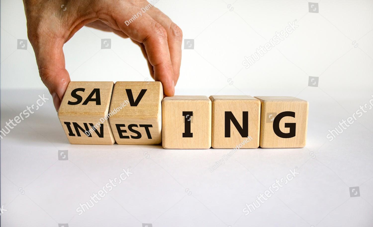 stock-photo-saving-or-investing-symbol-businessman-turns-cubes-and-changes-the-word-investing-to-sav.jpg